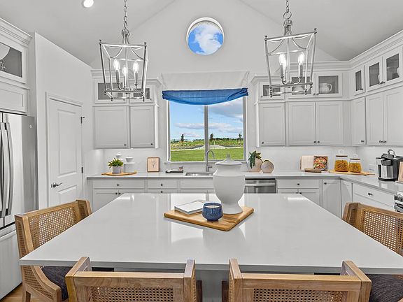 Kitchen with island and vaulted ceiling