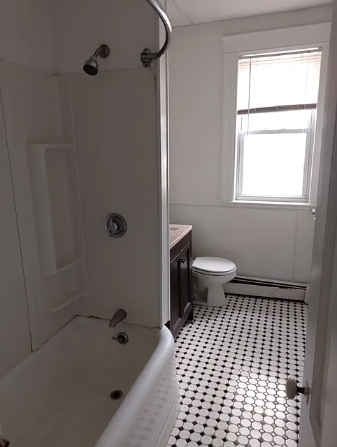 Bath with ceramic tile floor