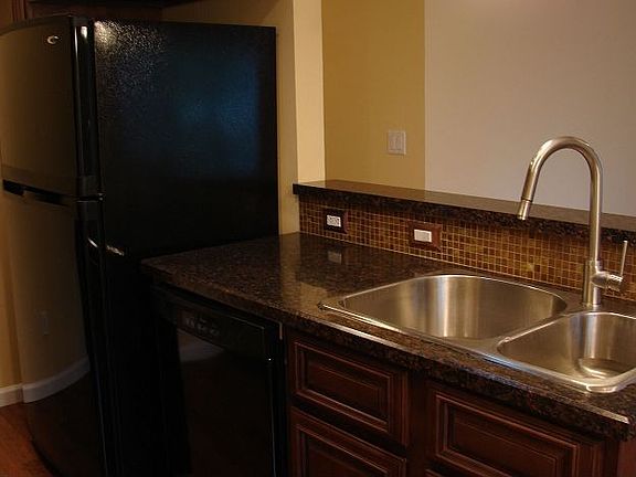 Stainless double-bowl sink with pullout faucet