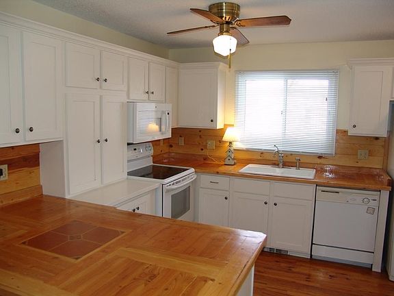 Open kitchen with unique wood countertops