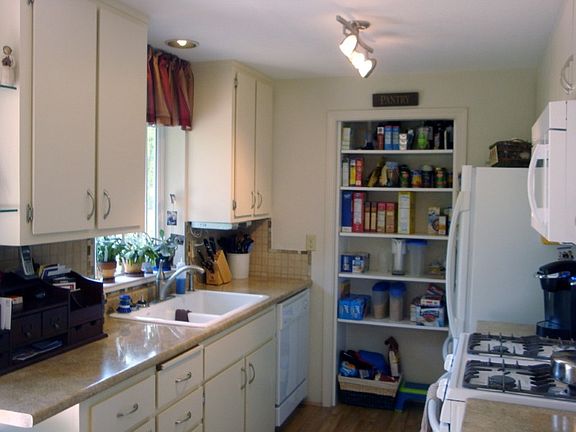 Updated kitchen wiith all appliances and backyard view from kitchen sink.
