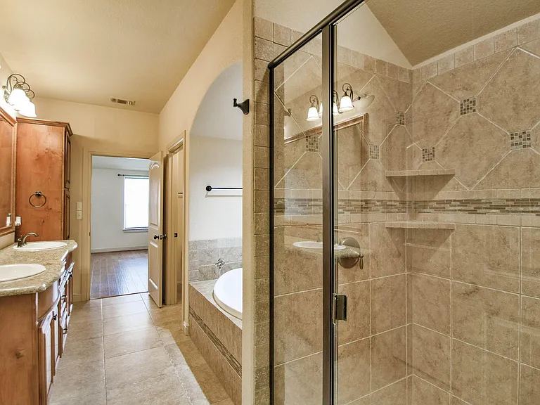 Primary bathroom with separate shower and soaking tub