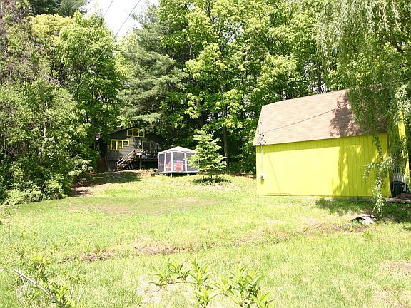 Front with yard and 2 story garage