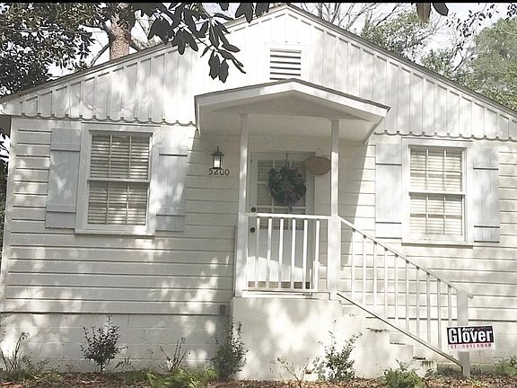 Freshly painted exterior with new wooden shutters