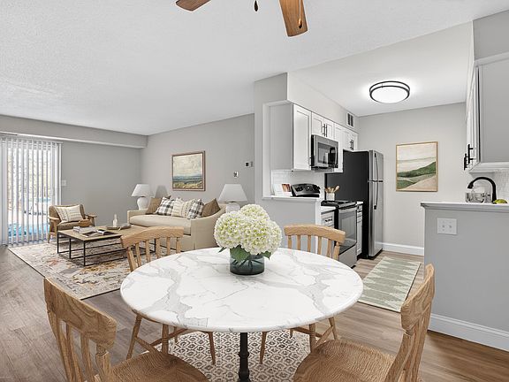 Welcome to Bay Ridge at Nashua Apartments, where modern comfort meets inviting spaces. Enjoy a stylish kitchen, cozy living area, and elegant dining setup perfect for gatherings. Schedule a tour today and envision your new home!