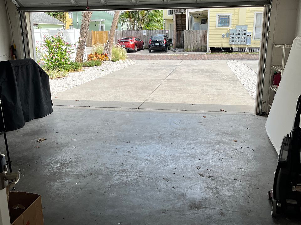 A view of the garage and driveway from the Kitchen hallway door.