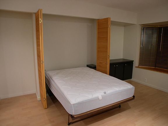 Murphy Bed included with night table.