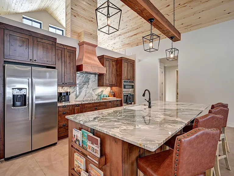 The lodge offers a few cookbooks to entice you to to use those cooking skills while you relax during your stay. The open concept still allows the chefs to keep an eye on the ballgame.