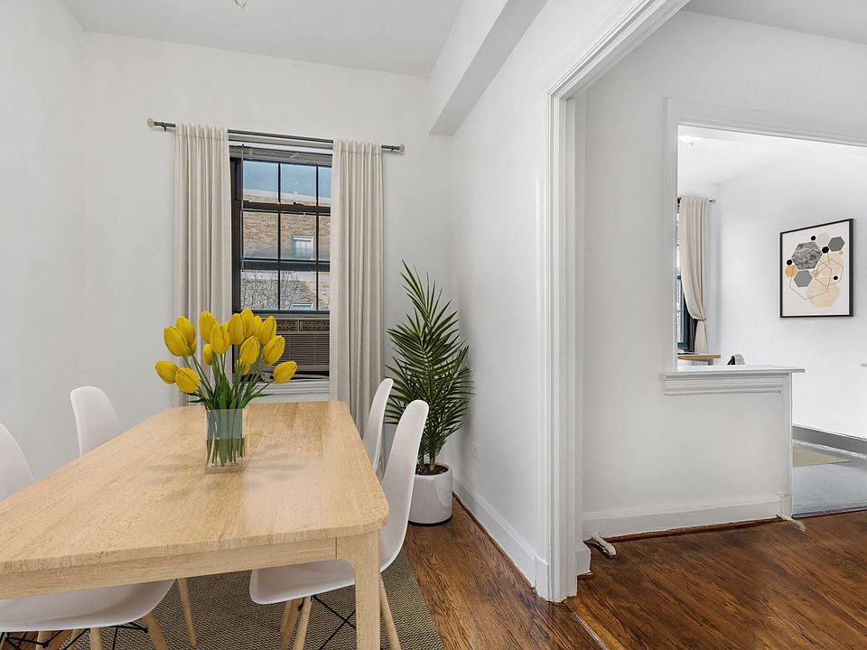 Dining and sunroom (virtually staged)