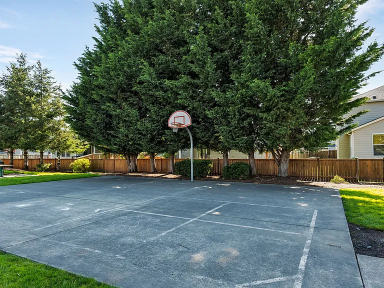 Basketball court across the street from the home.