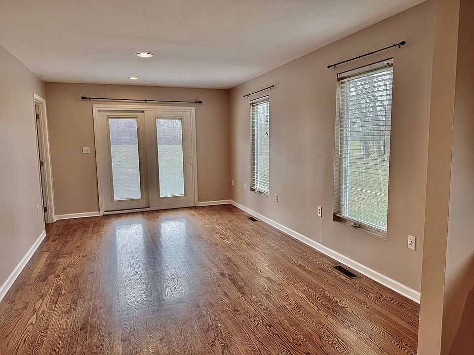 Living room or dining room with a patio door to the patio.