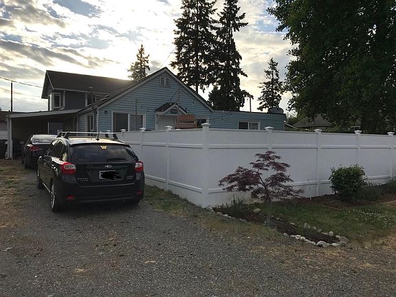 Car port with lengthy driveway
