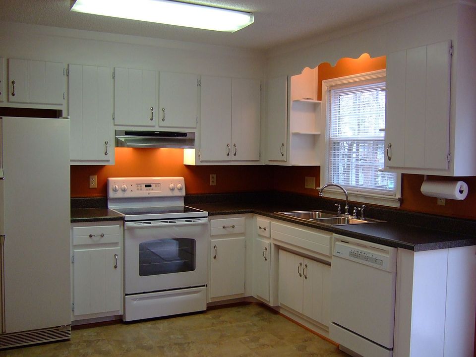 Updated kitchen features new counters and appliances.
