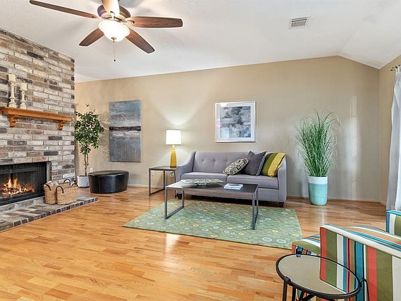 From the moment you enter, you feel right at home. High ceilings, big living areas, warm colors, engineered wood flooring and brick fireplace. This home is priced to sell fast and is ready for immediate move in.