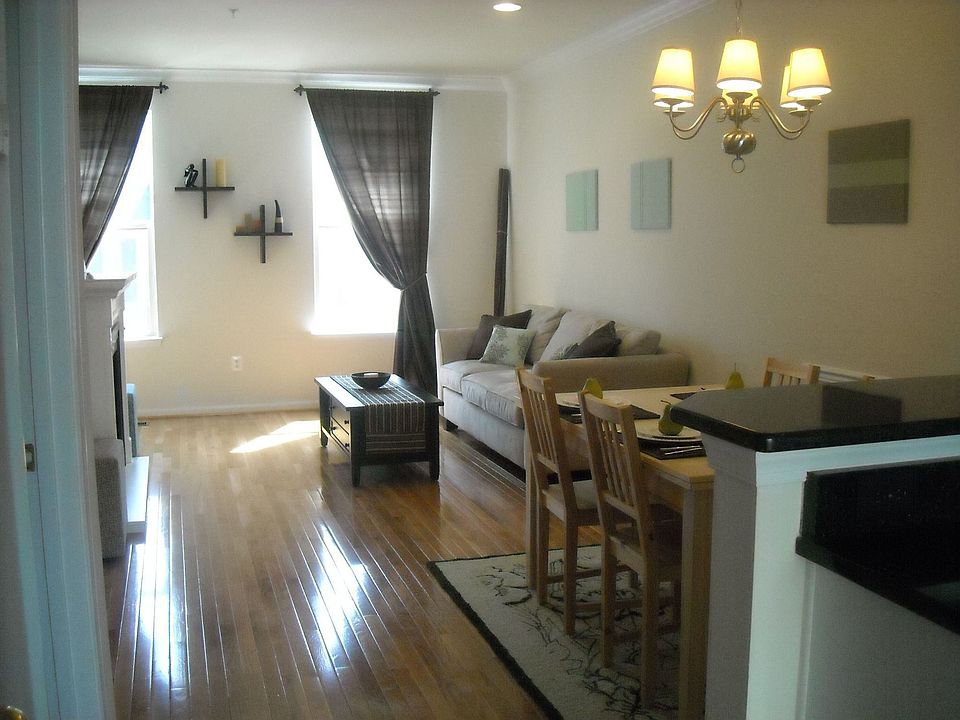 open floor plan with hardwoods and fireplace