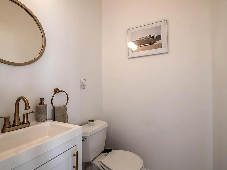 First floor half bath off kitchen.