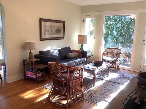 Living room in AM light (8:30am in February), looking to back yard and toward dining room