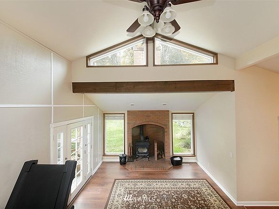 Large main level living room with wood fireplace
