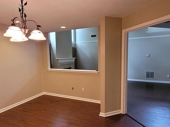 Looking into the livingroom area from the formal dining area. The area could accommodate a china cabinet, serving/buffet cabinet, and an 8-person table.