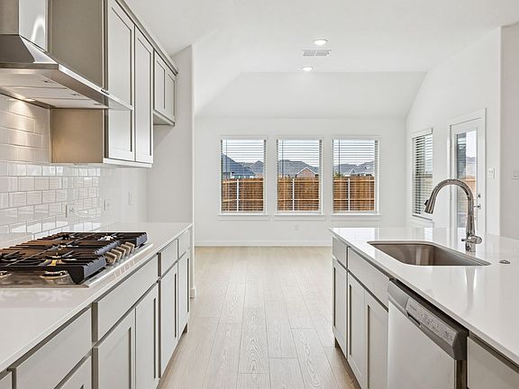 Kitchen in the Gilmour II home plan by Trophy Signature Homes - REPRESENTATIVE PHOTO