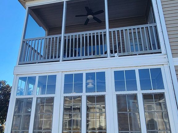 screened porch overlooking pond and fountain