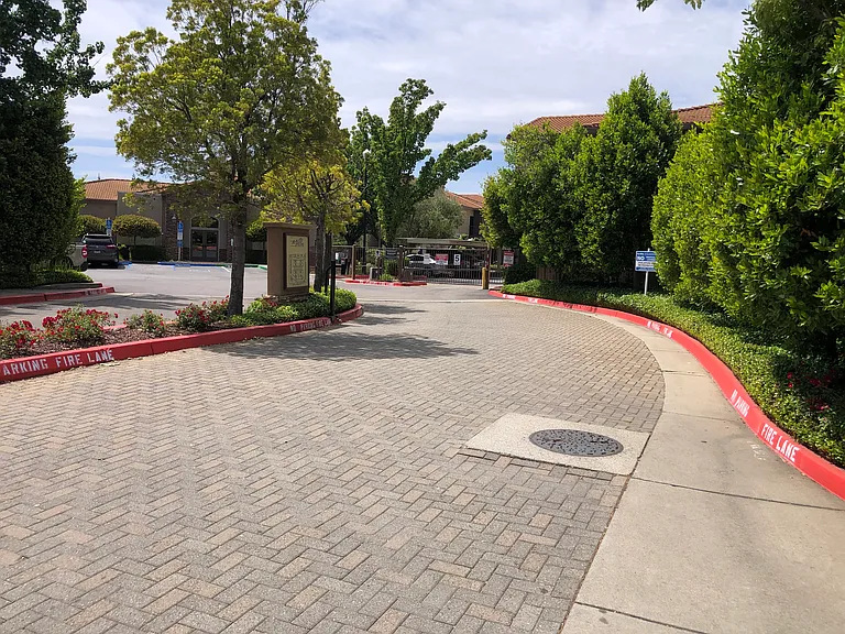 Beautifully landscaped private gated entrance.