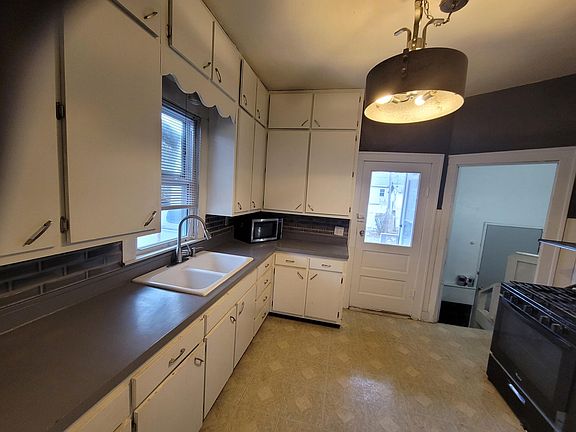 Kitchen. Includes gas stove and new stainless steel new fridge