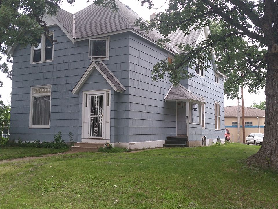 Exterior. Front entrance to unit is up the darker colored st