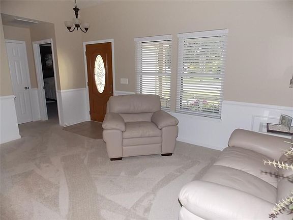 Vaulted ceiling & chair rail n this attractive 13 X 16 great room. Newer plush carpet in great room, family room, hallway, & bedrooms. Guest closet nearby.
