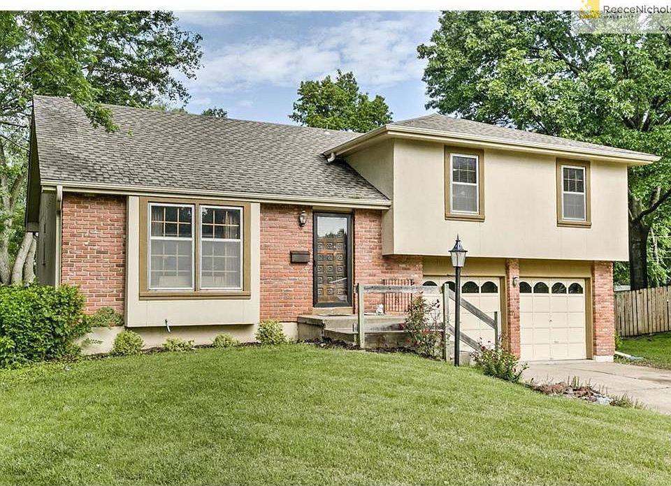 Welcome to 11712 W. 49th! Nice timeless brick, stucco, and frame exterior.