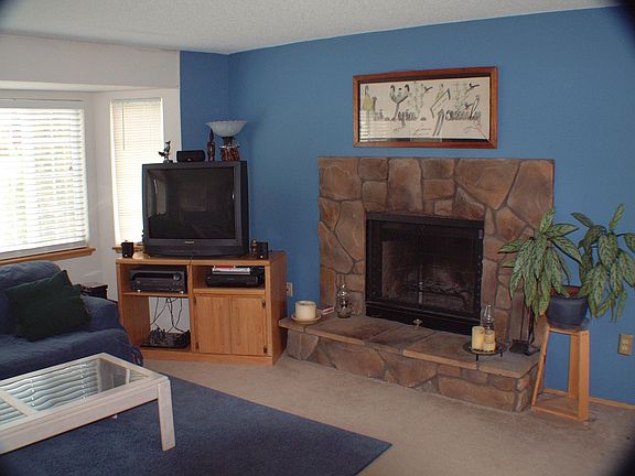 Living room with bay window and fireplace