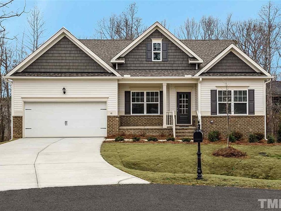 Exterior is a mix of vinyl and brick