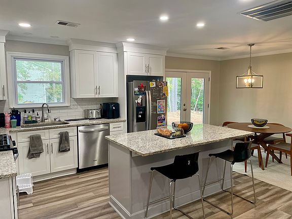 Kitchen with Island, Granite Counters and Stainless Steel Appliances