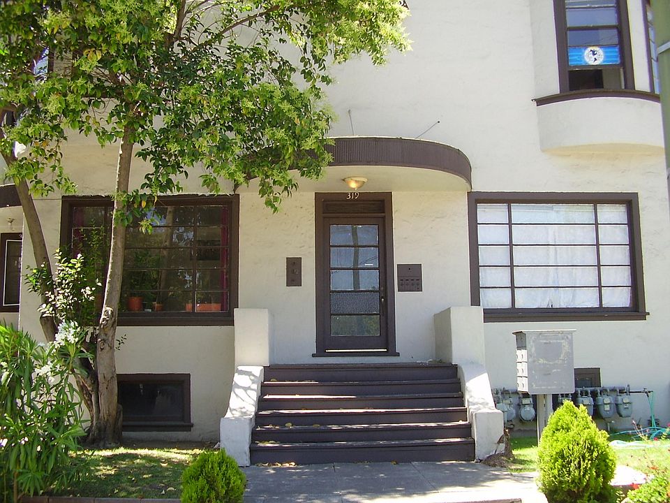 Front of building. Apartment is top right window