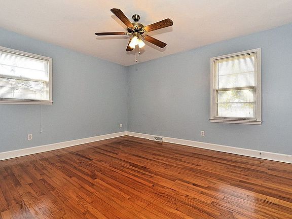 Serene master bedroom with hardwoods has en-suite half-bath.