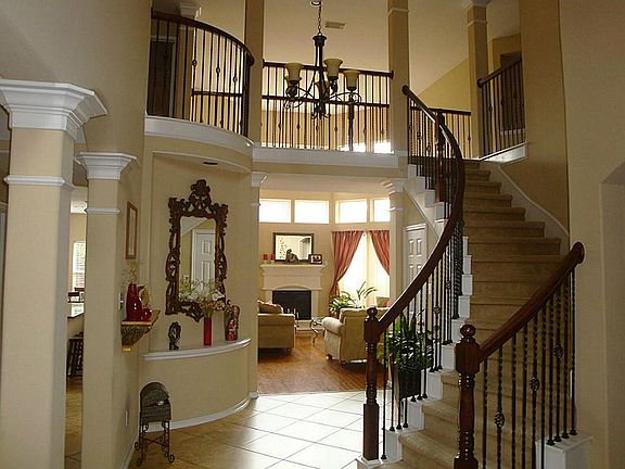 View of stairway and living room from entry