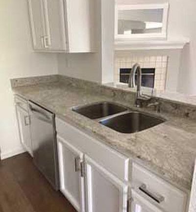 New granite, sink,, faucet, and garbage disposal