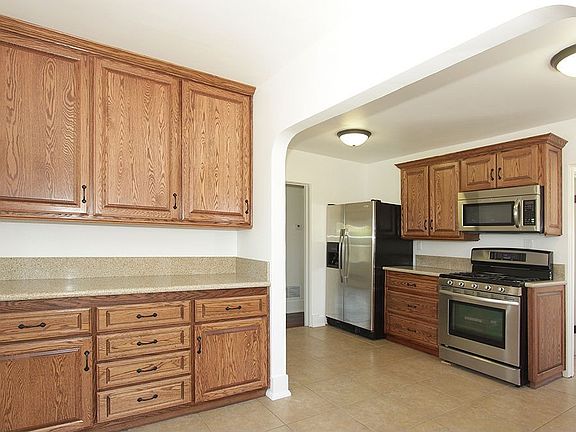 Open Kitchen with New Stainless Steel Appliances
