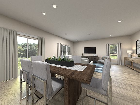 Residence 4 dining room virtually staged at Traverse at Winding Creek.