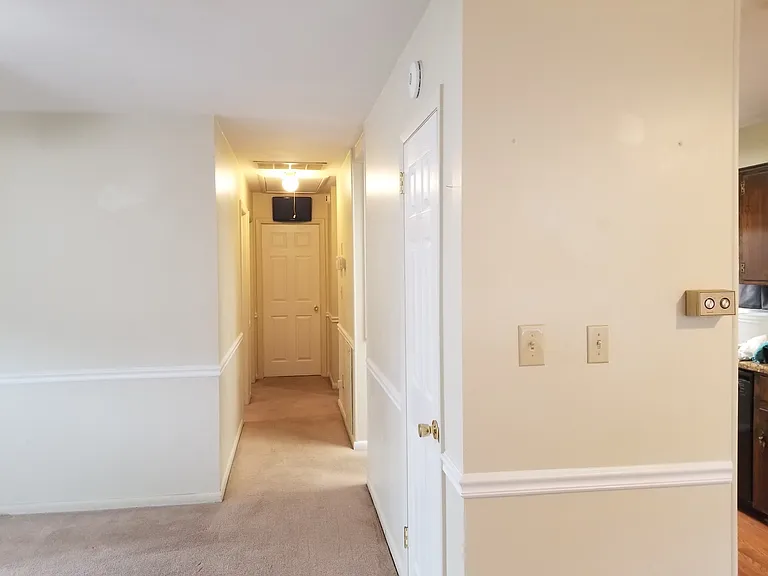 Hallway.
Living room on left.
Kitchen on right.