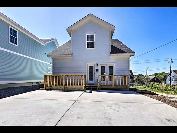 Back side of the house and upstairs unit entrance
