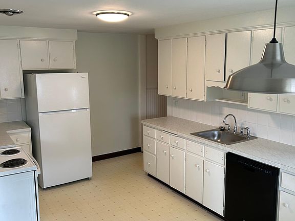Large working kitchen has room for small table and chairs.