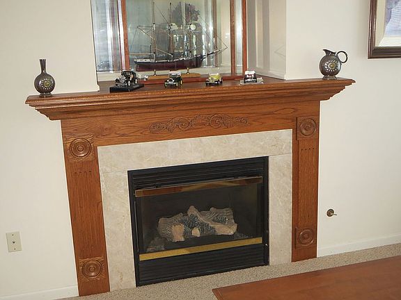 Fireplace w/wood mantel/trim