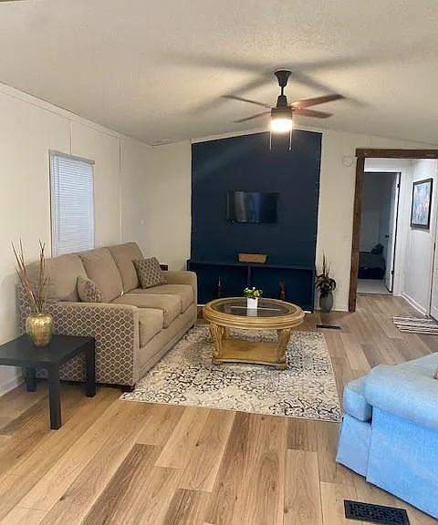 Living room with LED wall mounted TV.