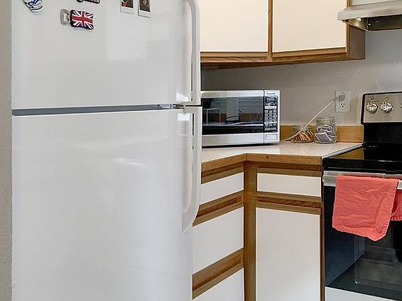 Kitchen (left) - recent refrigerator. Microwave is not included.