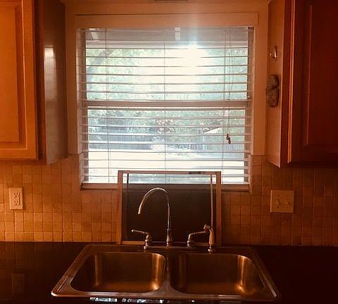 View of the kitchen sink looking to the backyard.