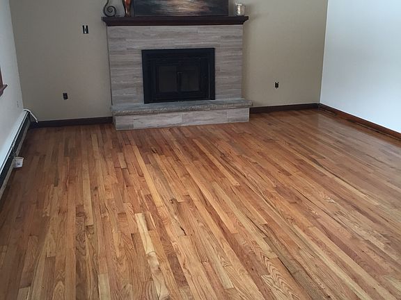 Gleaming hardwood& fireplace