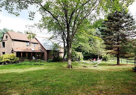 Stylishly designed contemporary home sited on beautiful property within steps to Nature Preserve and Lachat Farm