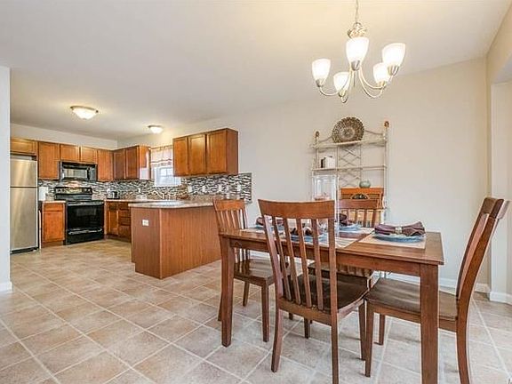 Breakfast bar and a dining space large enough to accommodate a large group.