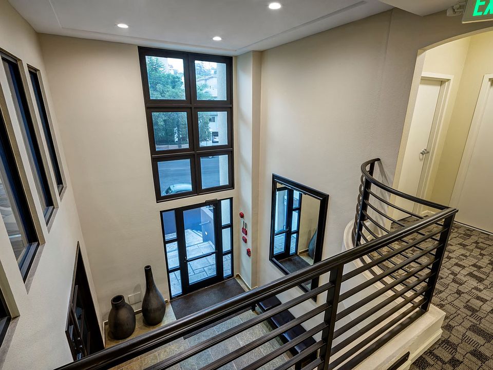 Apartments in Hollywood, CA - Upstairs View of Building Main Entrance and Lobby Area summit.
